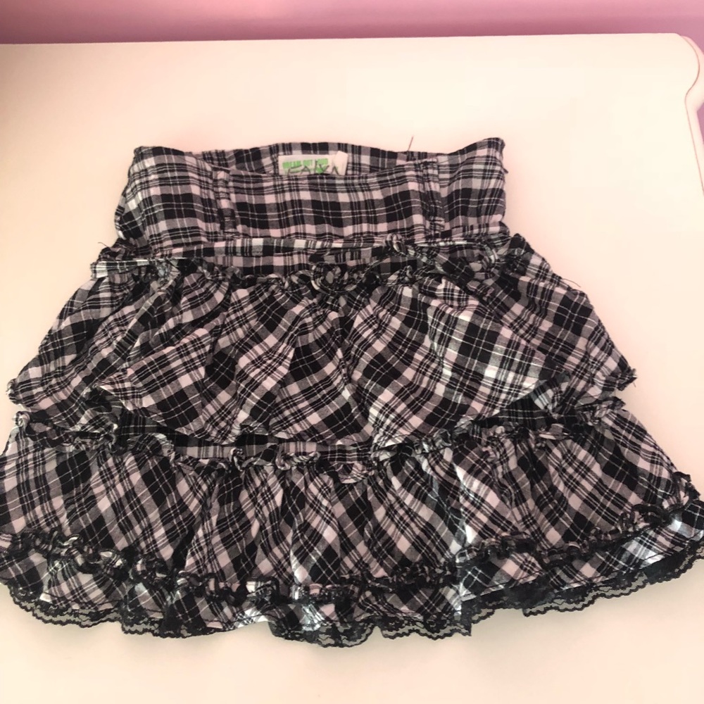 Funky black and white mini skirt with tie around.